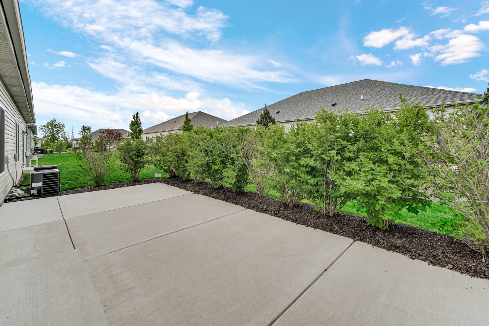 925 Baltimore Street McHenry, IL 60050 - Photo 24 of 27 a view of a pathway both side of grassy field with shrub