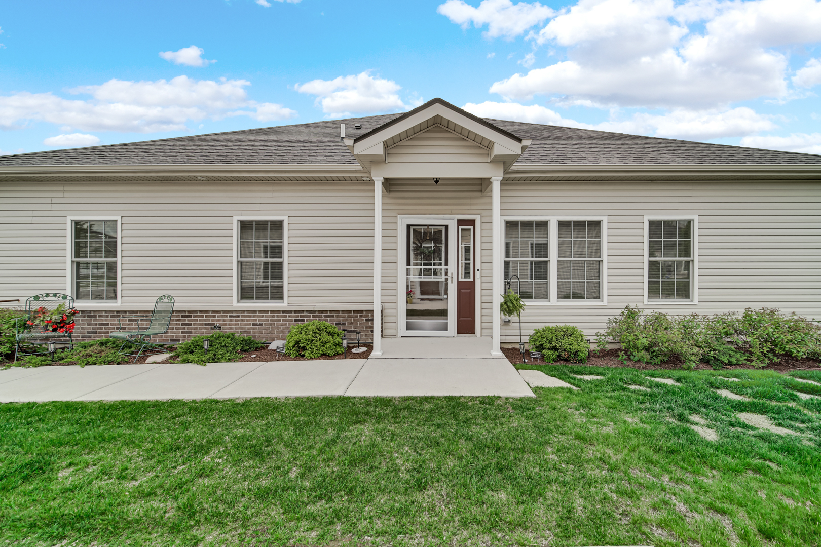 925 Baltimore Street McHenry, IL 60050 - Photo 3 of 27 a front view of a house with a garden