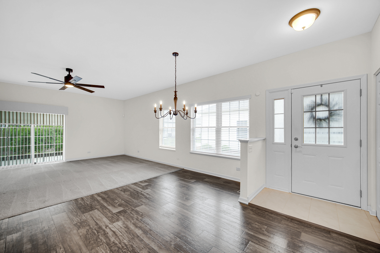 925 Baltimore Street McHenry, IL 60050 - Photo 4 of 27 a view of empty room with wooden floor and fan
