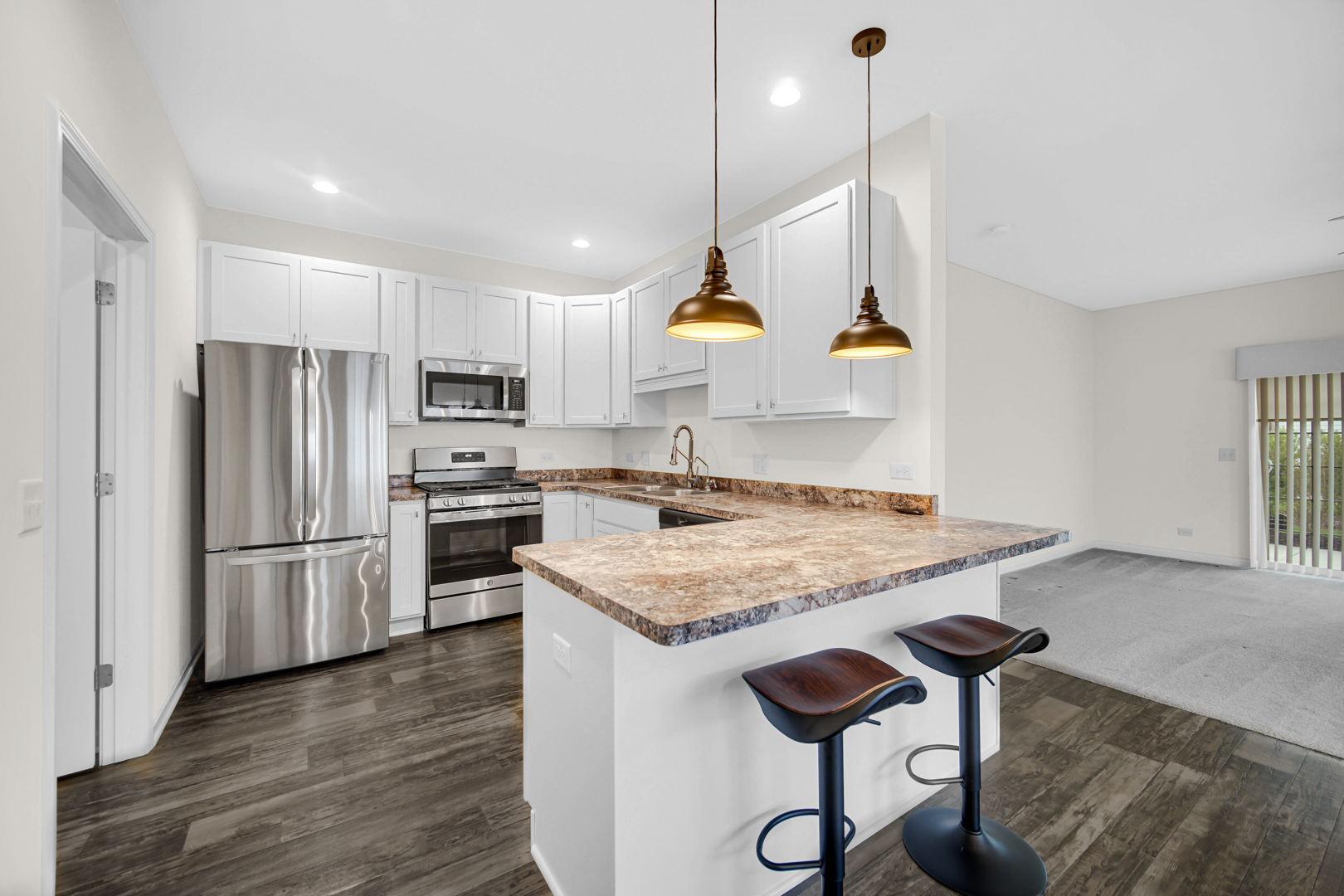 925 Baltimore Street McHenry, IL 60050 - Photo 5 of 27 a kitchen with stainless steel appliances granite countertop a refrigerator a sink dishwasher a stove and a refrigerator
