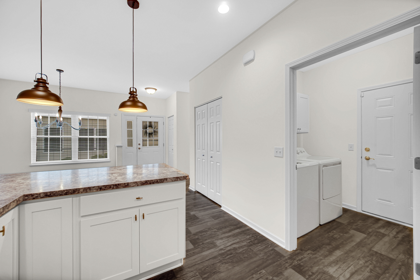 925 Baltimore Street McHenry, IL 60050 - Photo 8 of 27 a kitchen with stainless steel appliances granite countertop a sink a window and cabinets