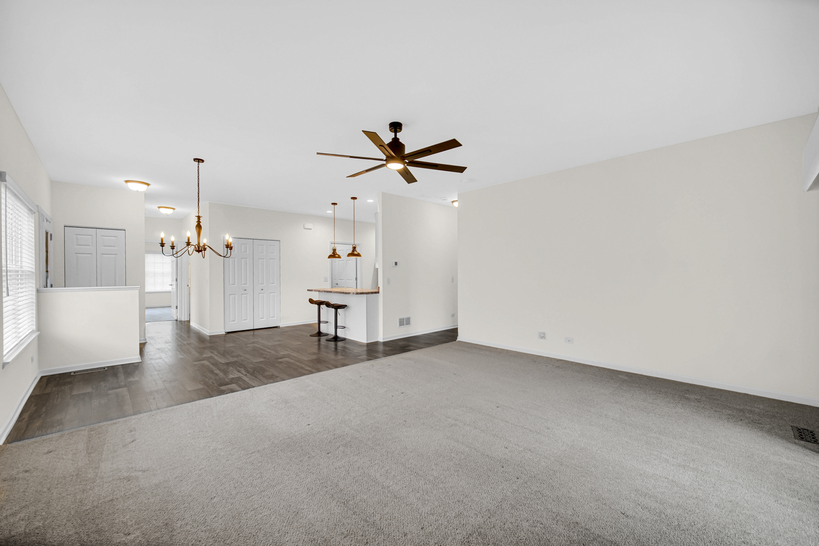925 Baltimore Street McHenry, IL 60050 - Photo 10 of 27 an empty room with a ceiling fan and window
