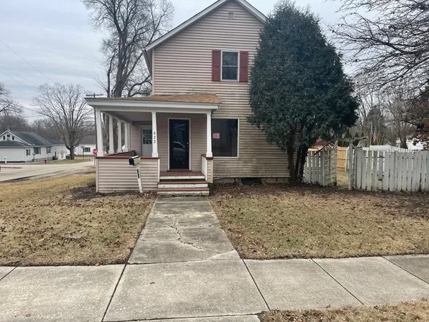 a front view of a house with garage