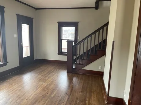 a view of entryway with wooden floor