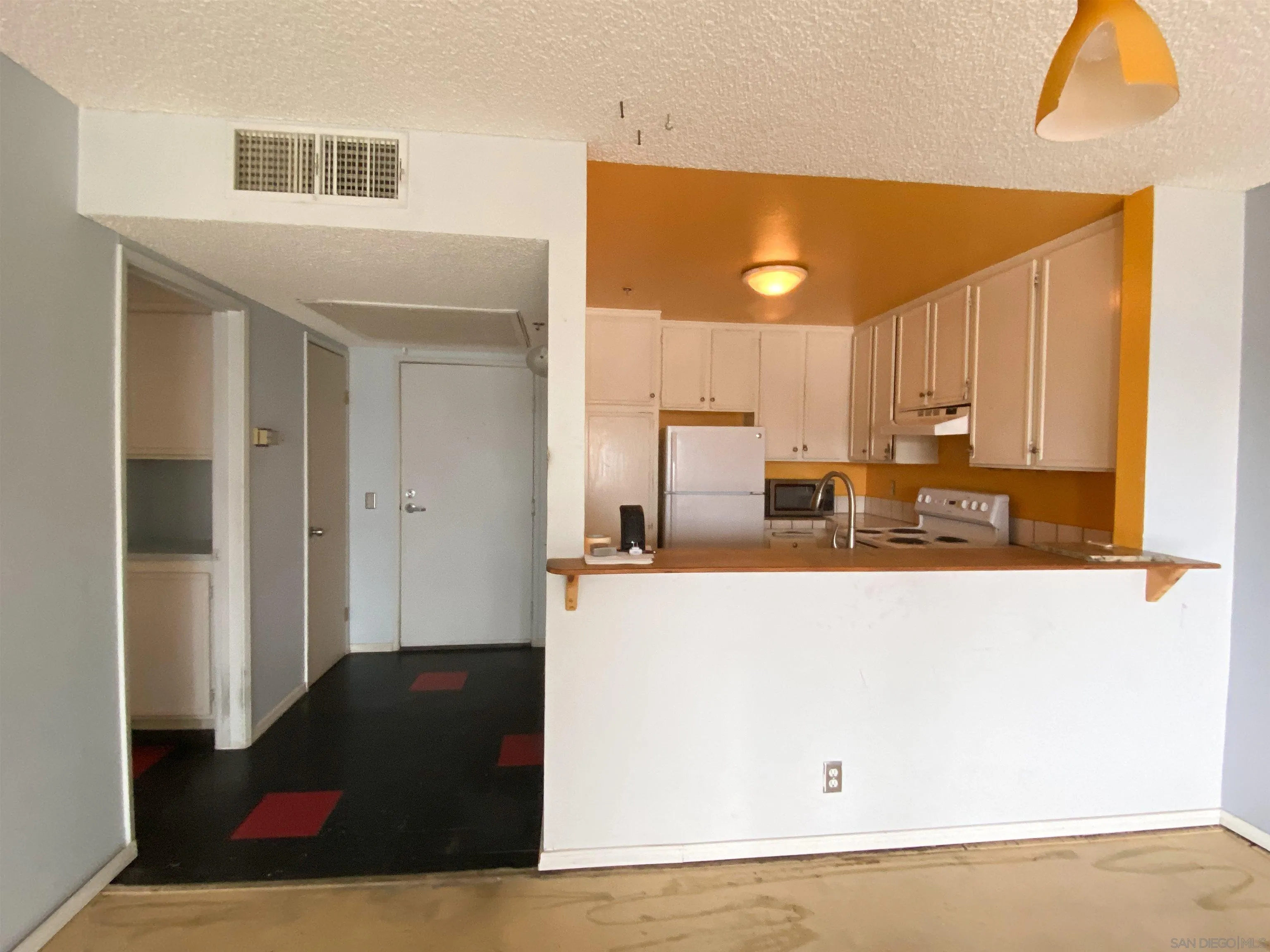 3955 Faircross Place, Unit 45 San Diego, CA 92115 - Photo 9 of 14 a kitchen with stainless steel appliances a refrigerator and a stove