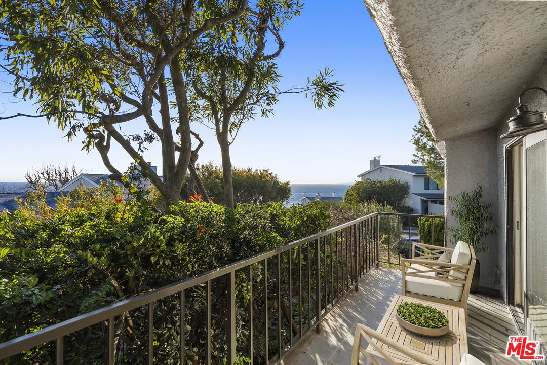 6801 Seawatch Lane Malibu, CA 90265 - Photo 12 of 28 a view of a balcony with chairs