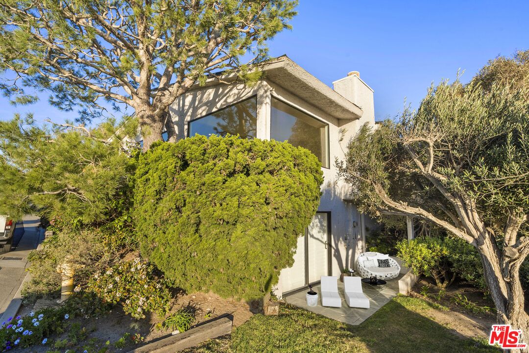 6801 Seawatch Lane Malibu, CA 90265 - Photo 17 of 28 a backyard of a house with lots of green space