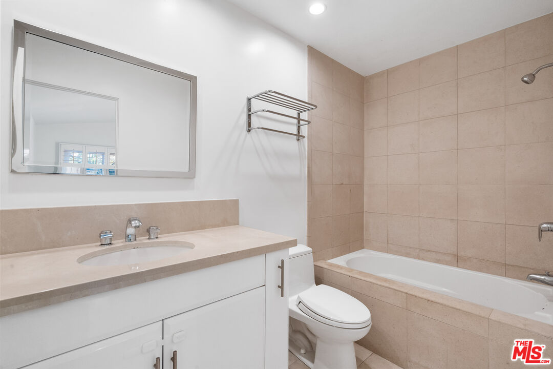 6801 Seawatch Lane Malibu, CA 90265 - Photo 20 of 28 a bathroom with a sink a toilet and shower