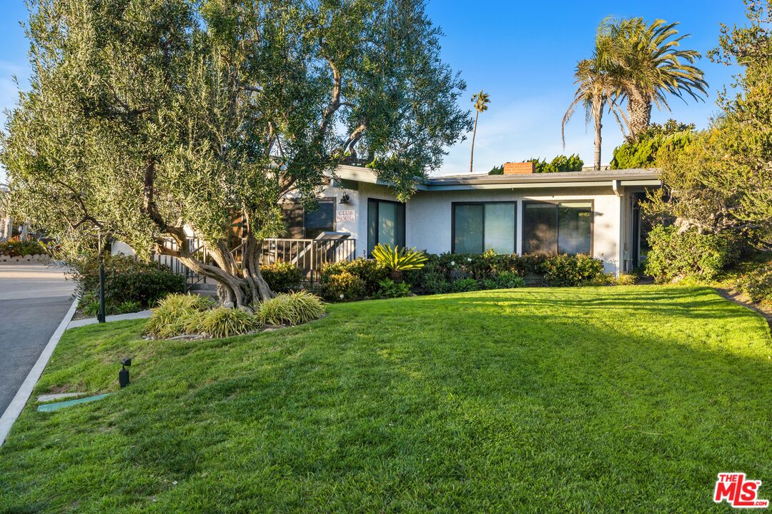 6801 Seawatch Lane Malibu, CA 90265 - Photo 22 of 28 a front view of a house with garden