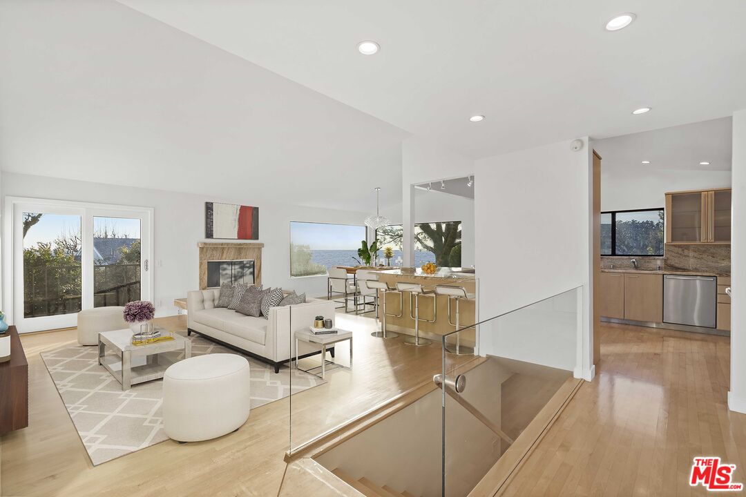 6801 Seawatch Lane Malibu, CA 90265 - Photo 8 of 28 a living room with furniture and a view of kitchen