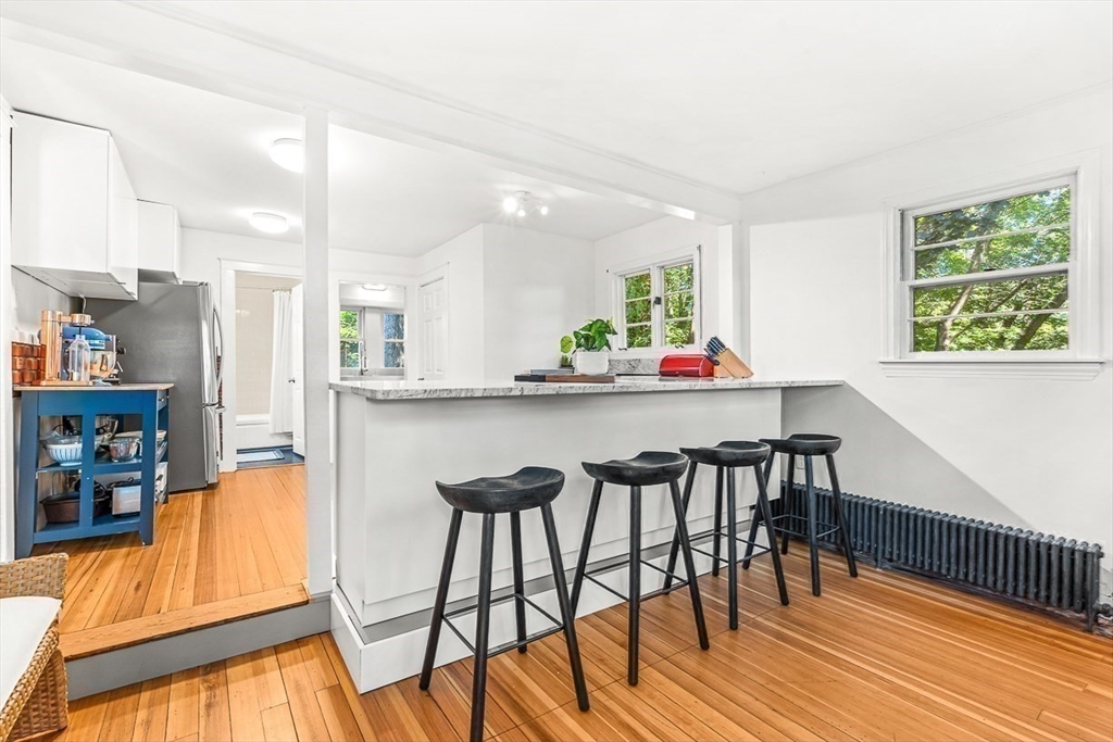 25 Sawin Street Natick, MA 01760 - Photo 13 of 19 a dining room with furniture and wooden floor