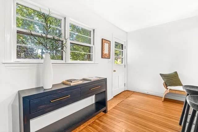 a room with a bed and windows