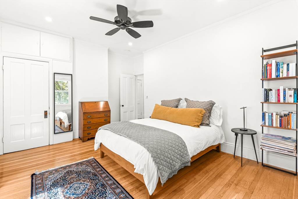 25 Sawin Street Natick, MA 01760 - Photo 15 of 19 a bedroom with a bed and a book shelf