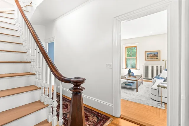 a view of a livingroom with furniture and stairs