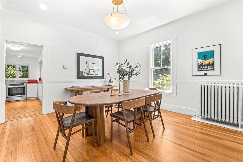 25 Sawin Street Natick, MA 01760 - Photo 7 of 19 a view of a dining room with furniture and wooden floor
