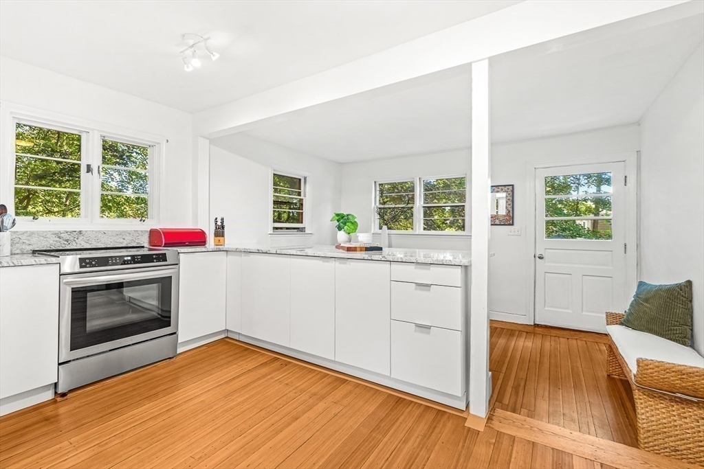 25 Sawin Street Natick, MA 01760 - Photo 10 of 19 a kitchen with a stove and wooden floor