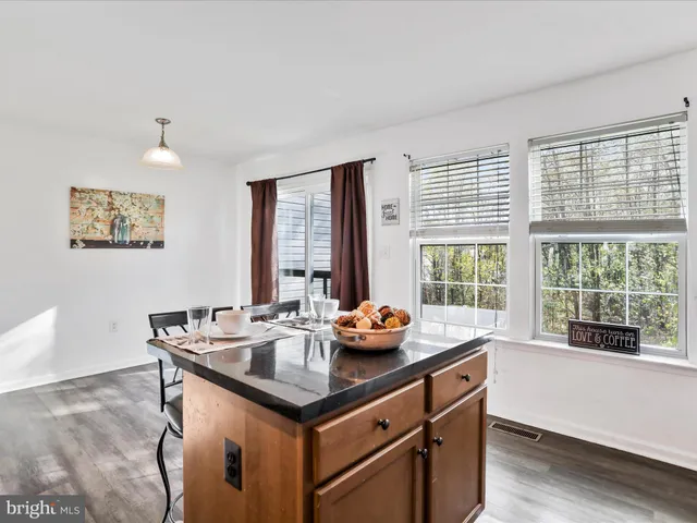 a dining room with a window and table