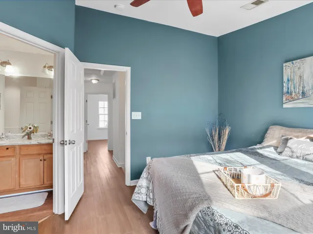 a bedroom with a bed and cabinets