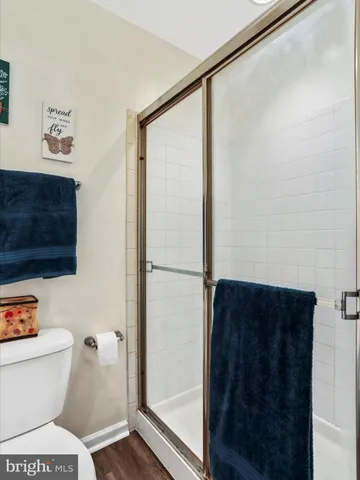 a bathroom with a toilet a sink and a shower
