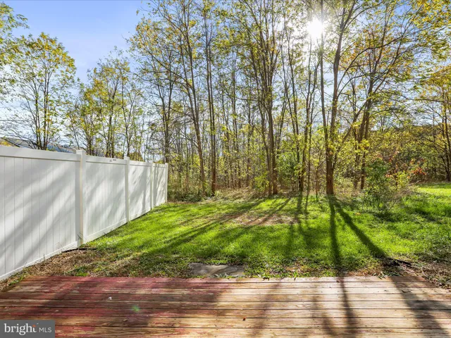 a front view of a building with a garden