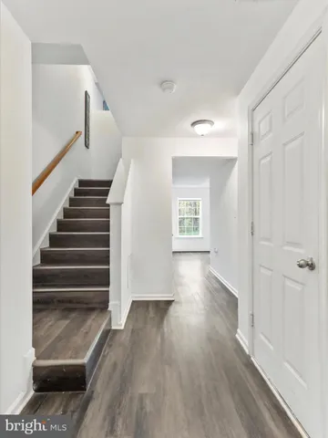 a view of entryway with wooden floor