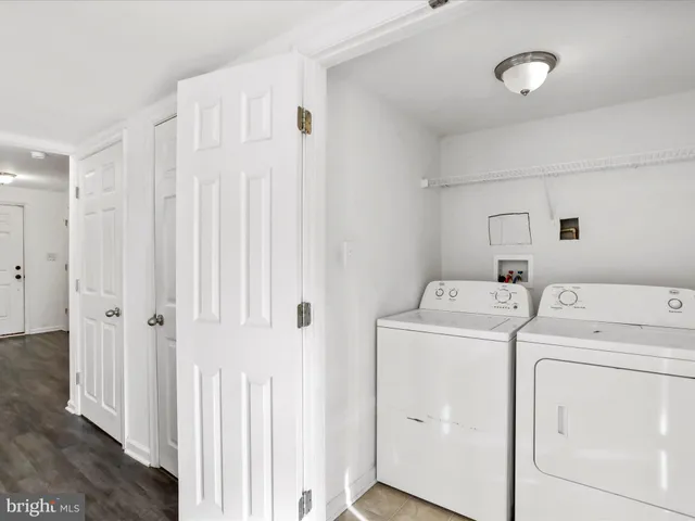 a view of storage and utility room with washer and dryer