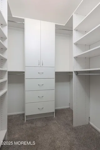 a bathroom with a granite countertop toilet sink and bathtub