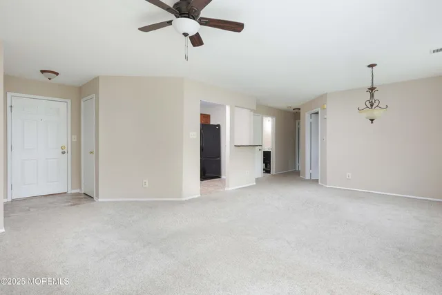 a living room with a couch and a window
