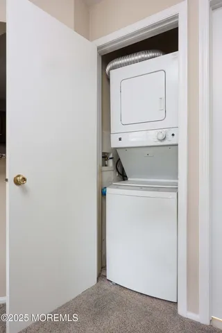 a white house with a large pool in front of it