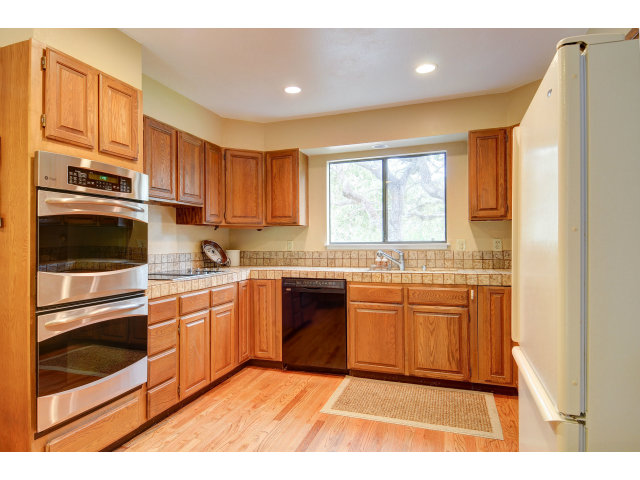3075 El Toro Road Pebble Beach, CA 93953 - Photo 11 of 25 a kitchen with stainless steel appliances granite countertop a stove a sink and a refrigerator
