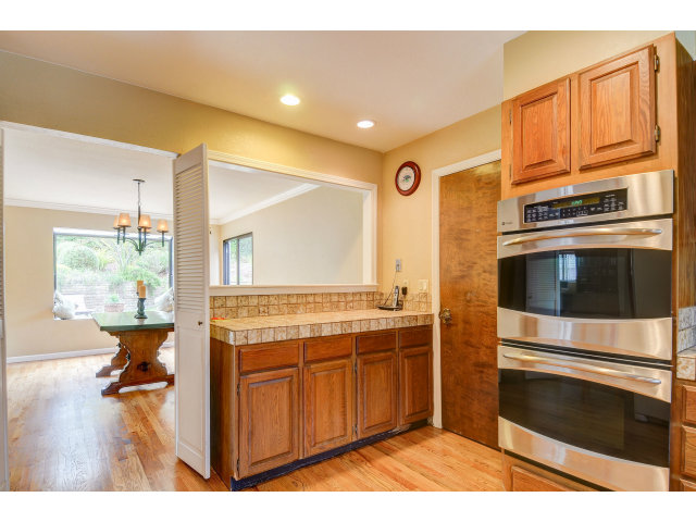 3075 El Toro Road Pebble Beach, CA 93953 - Photo 13 of 25 a kitchen with a stove and a microwave
