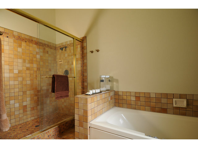 3075 El Toro Road Pebble Beach, CA 93953 - Photo 17 of 25 a bathroom with a shower and a bath tub