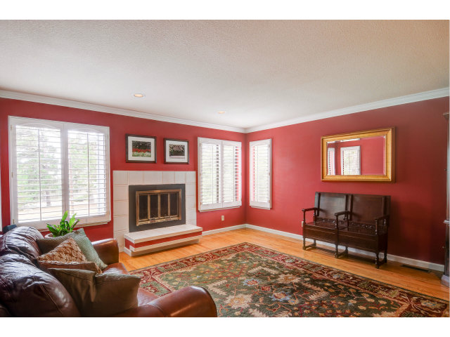 3075 El Toro Road Pebble Beach, CA 93953 - Photo 5 of 25 a living room with furniture a fireplace and a flat screen tv