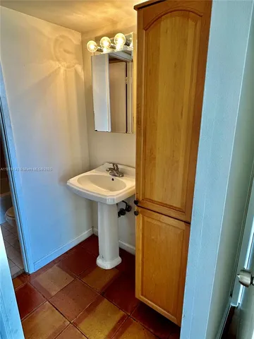 a bathroom with a sink and mirror