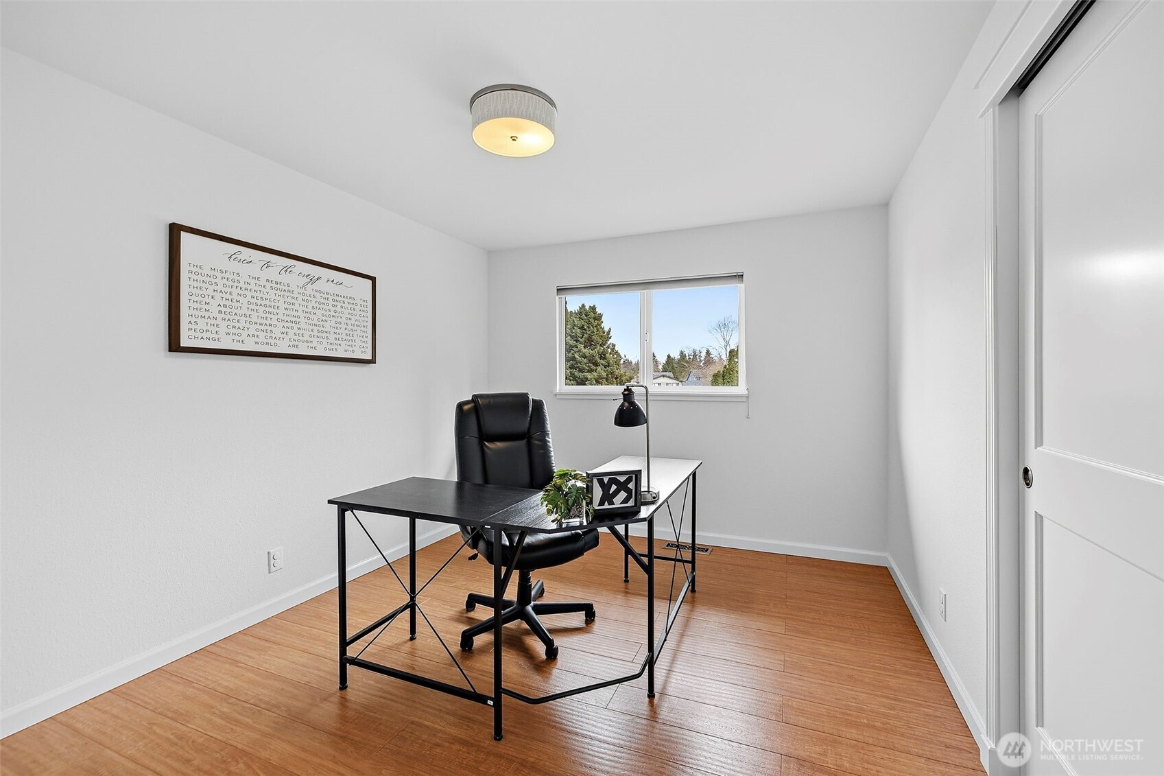 927 217th Street Southwest Bothell, WA 98021 - Photo 13 of 33 a view of a workspace with furniture and wooden floor