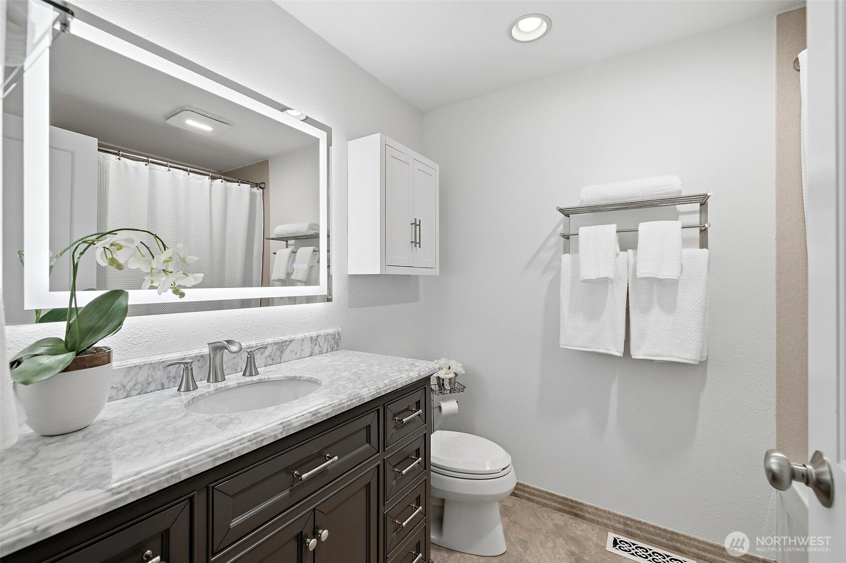 927 217th Street Southwest Bothell, WA 98021 - Photo 15 of 33 a bathroom with a granite countertop sink a toilet and mirror