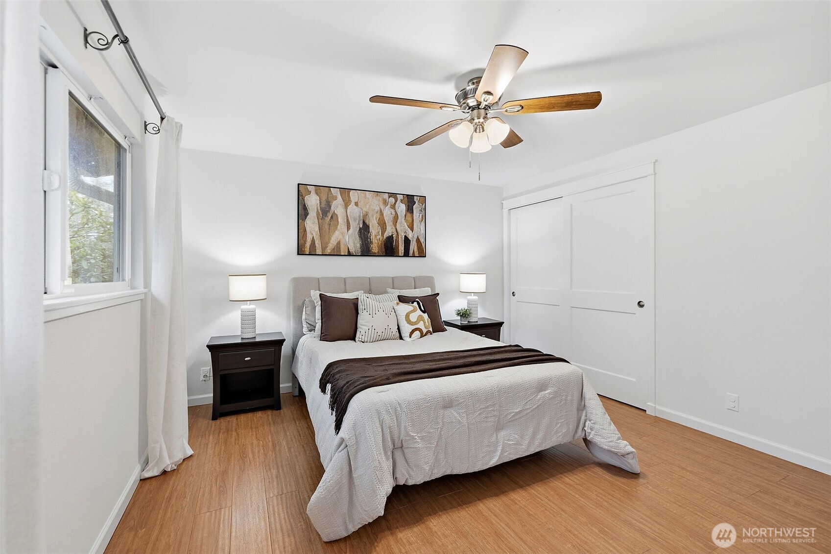 927 217th Street Southwest Bothell, WA 98021 - Photo 17 of 33 a bedroom with a bed and a chandelier