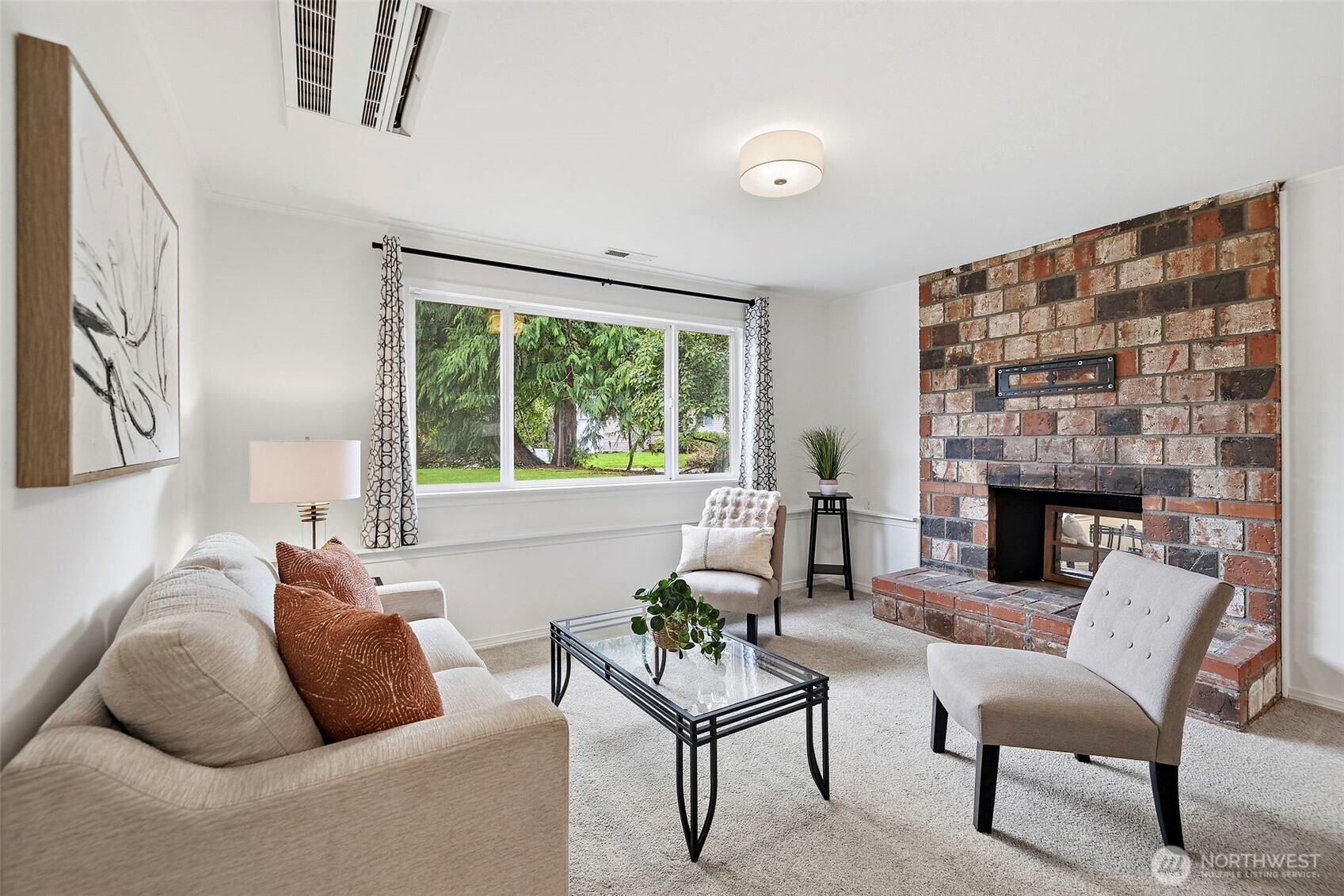 927 217th Street Southwest Bothell, WA 98021 - Photo 20 of 33 a living room with furniture a fireplace and a large window