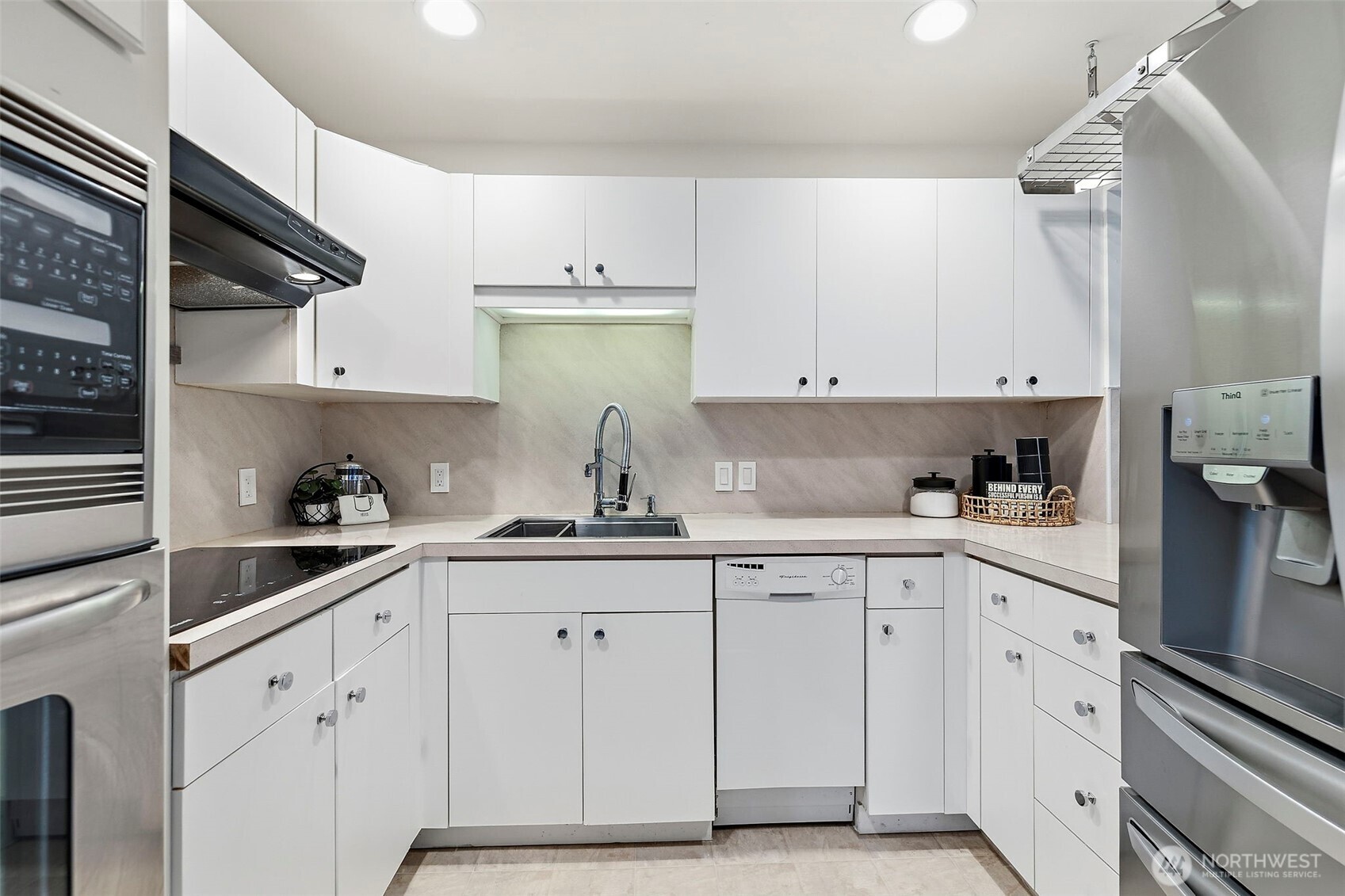 927 217th Street Southwest Bothell, WA 98021 - Photo 24 of 33 a kitchen with white cabinets and white appliances