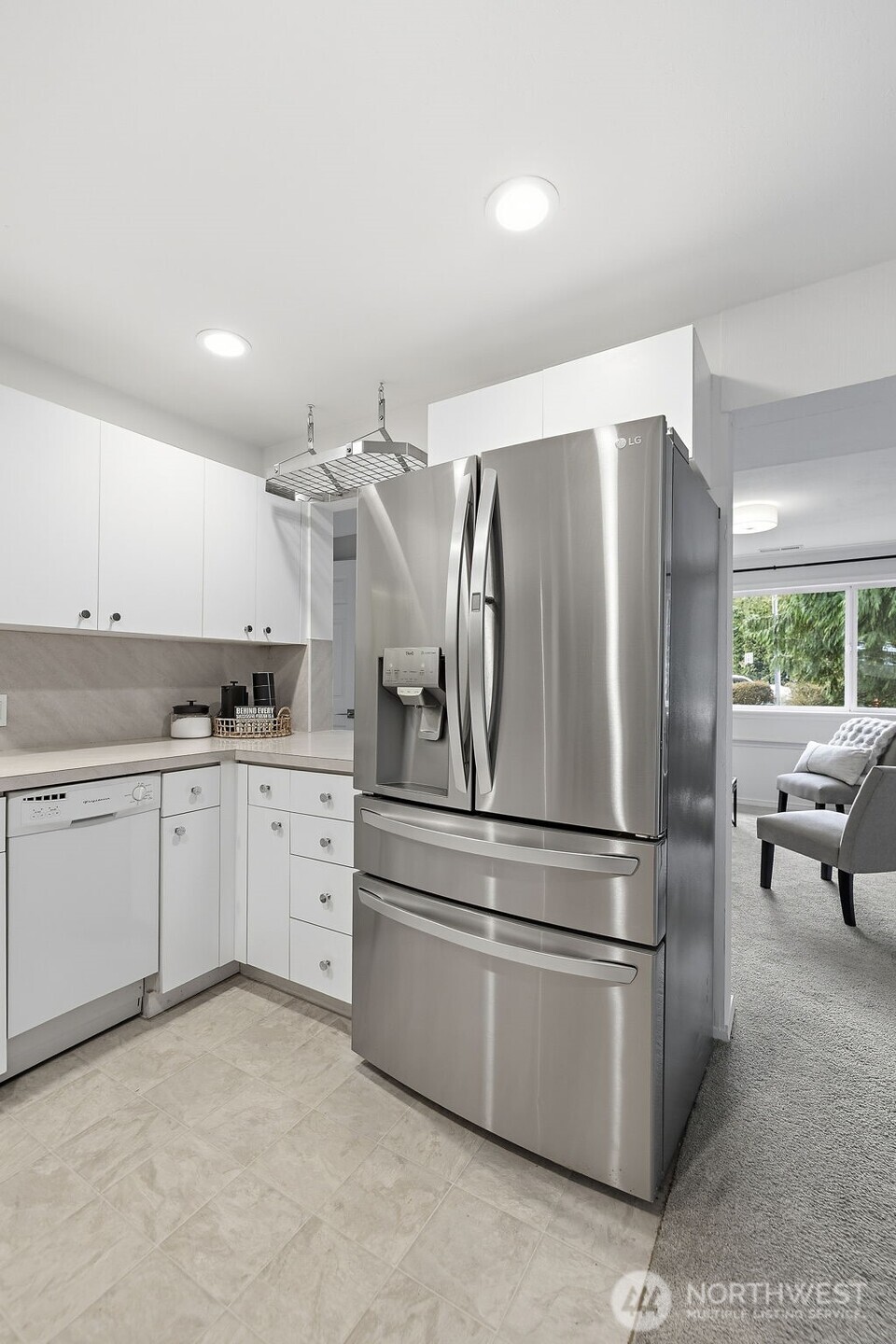 927 217th Street Southwest Bothell, WA 98021 - Photo 26 of 33 a kitchen with stainless steel appliances a refrigerator sink and cabinets