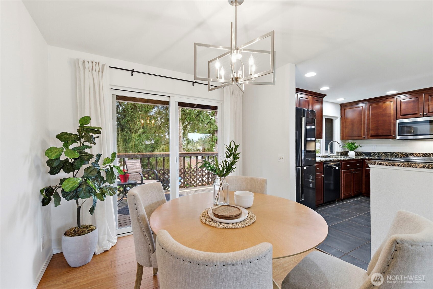 927 217th Street Southwest Bothell, WA 98021 - Photo 8 of 33 a view of a dining room with furniture window and wooden floor