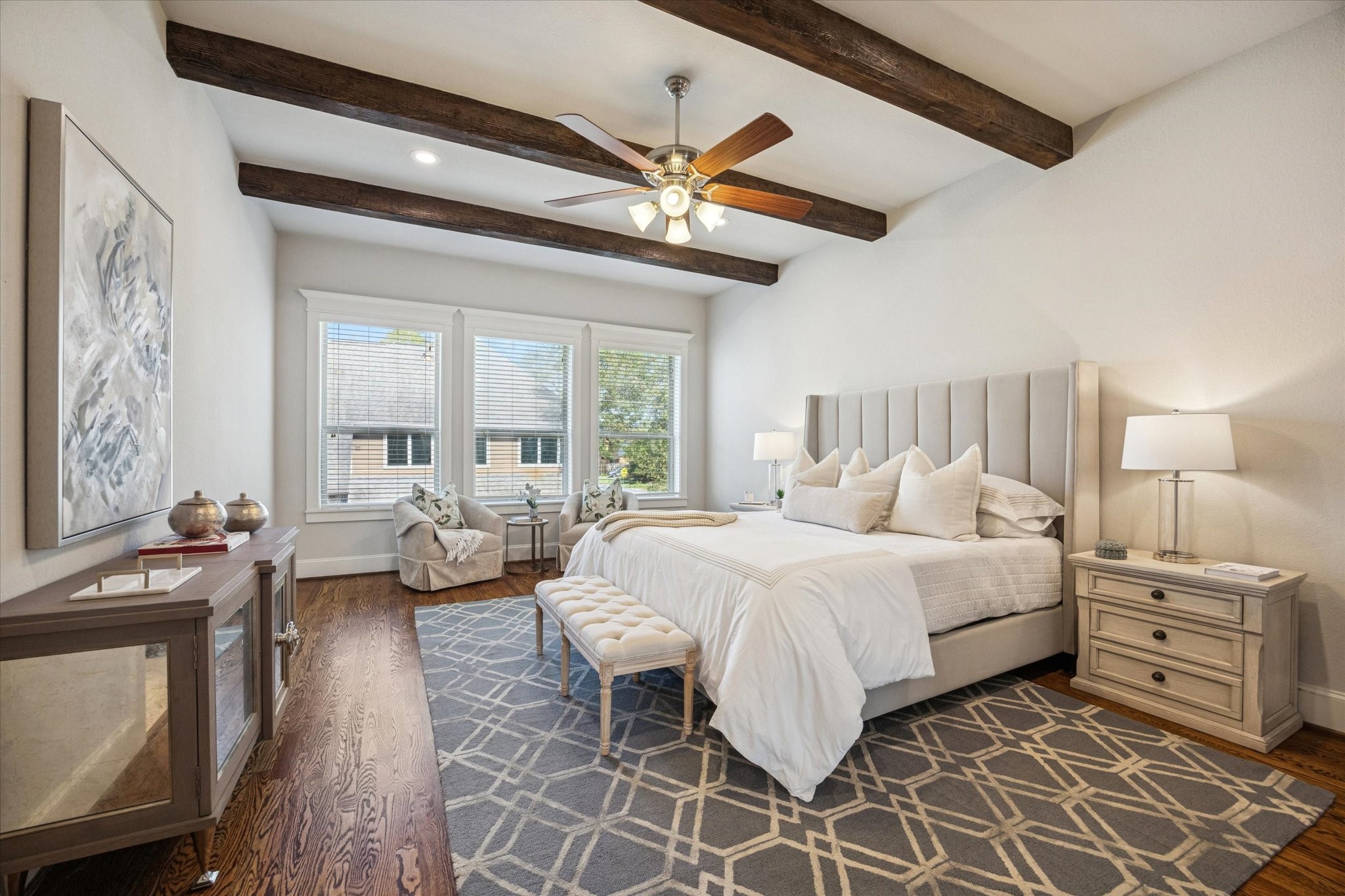 1802 Wakefield Drive Houston, TX 77018 - Photo 26 of 47 The primary bedroom is spacious with a neutral color palette, wooden beams and natural light.