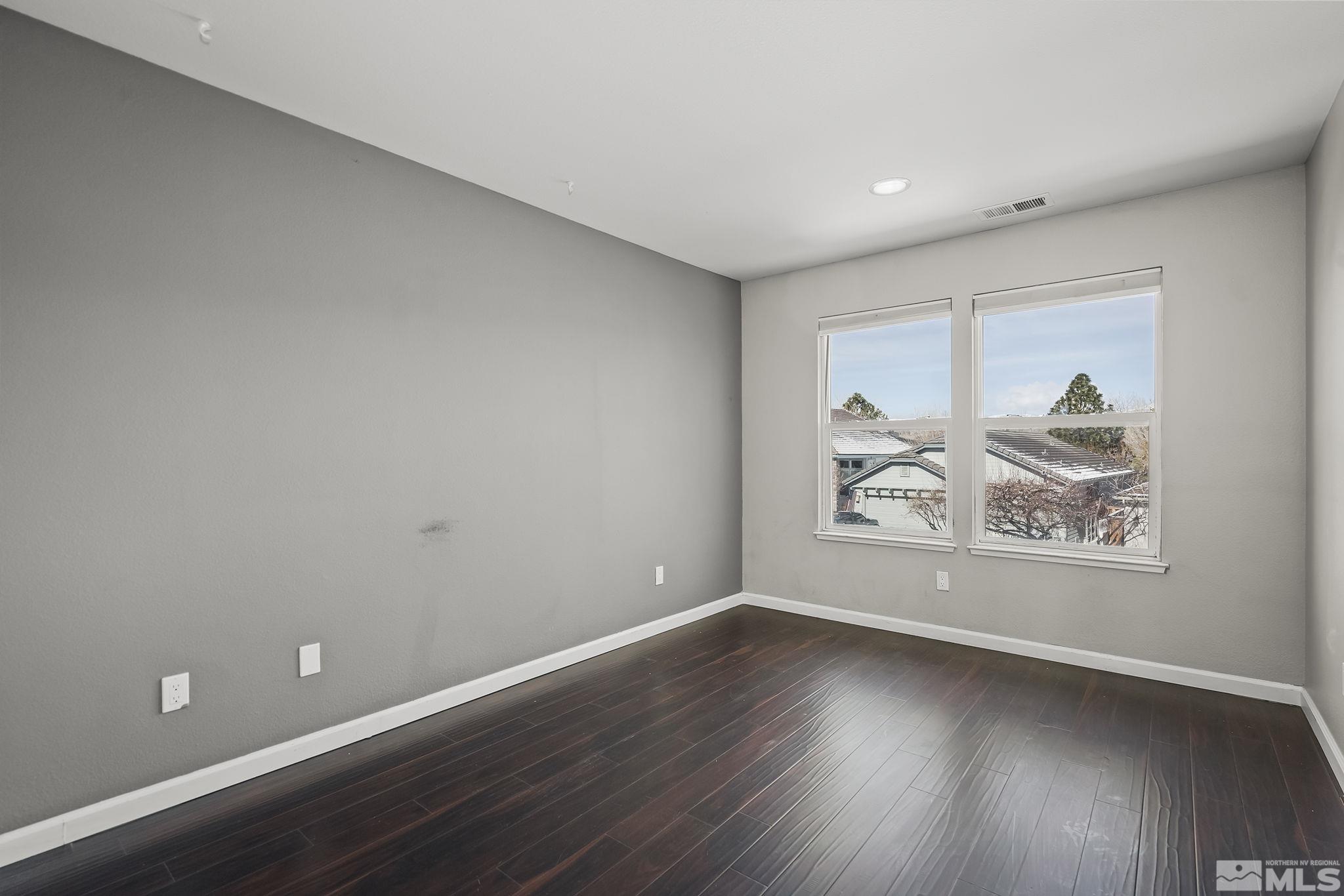 720 Caughlin Glen Reno, NV 89519 - Photo 17 of 24 a view of room with window and wooden floor