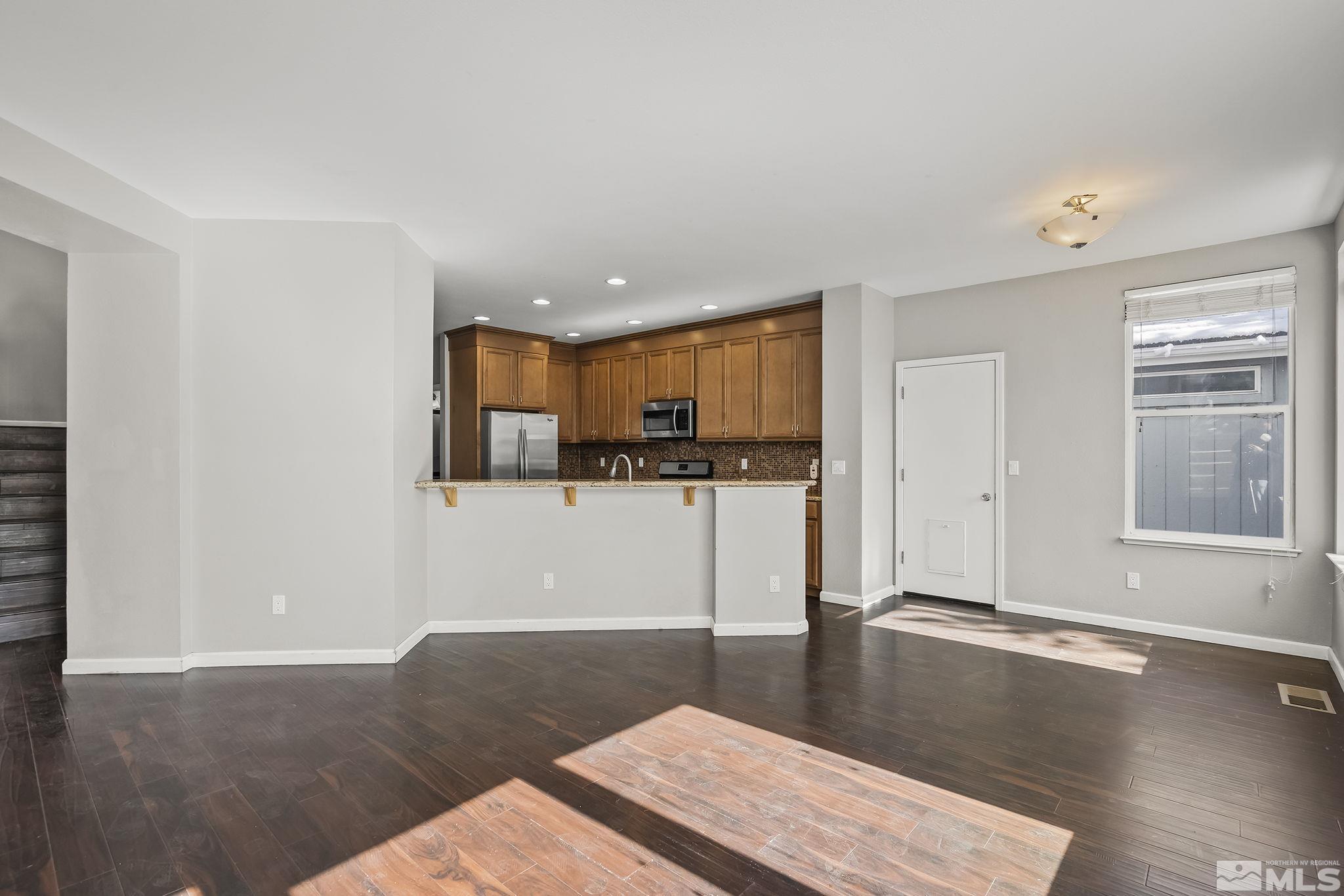 720 Caughlin Glen Reno, NV 89519 - Photo 9 of 24 a view of kitchen with cabinets and wooden floor