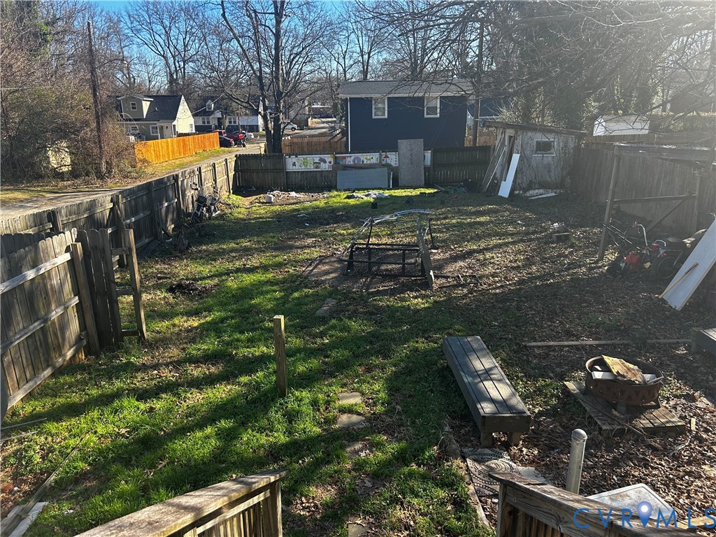 3703 Decatur Street Richmond, VA 23224 - Photo 13 of 14 Fenced backyard featuring a storage unit