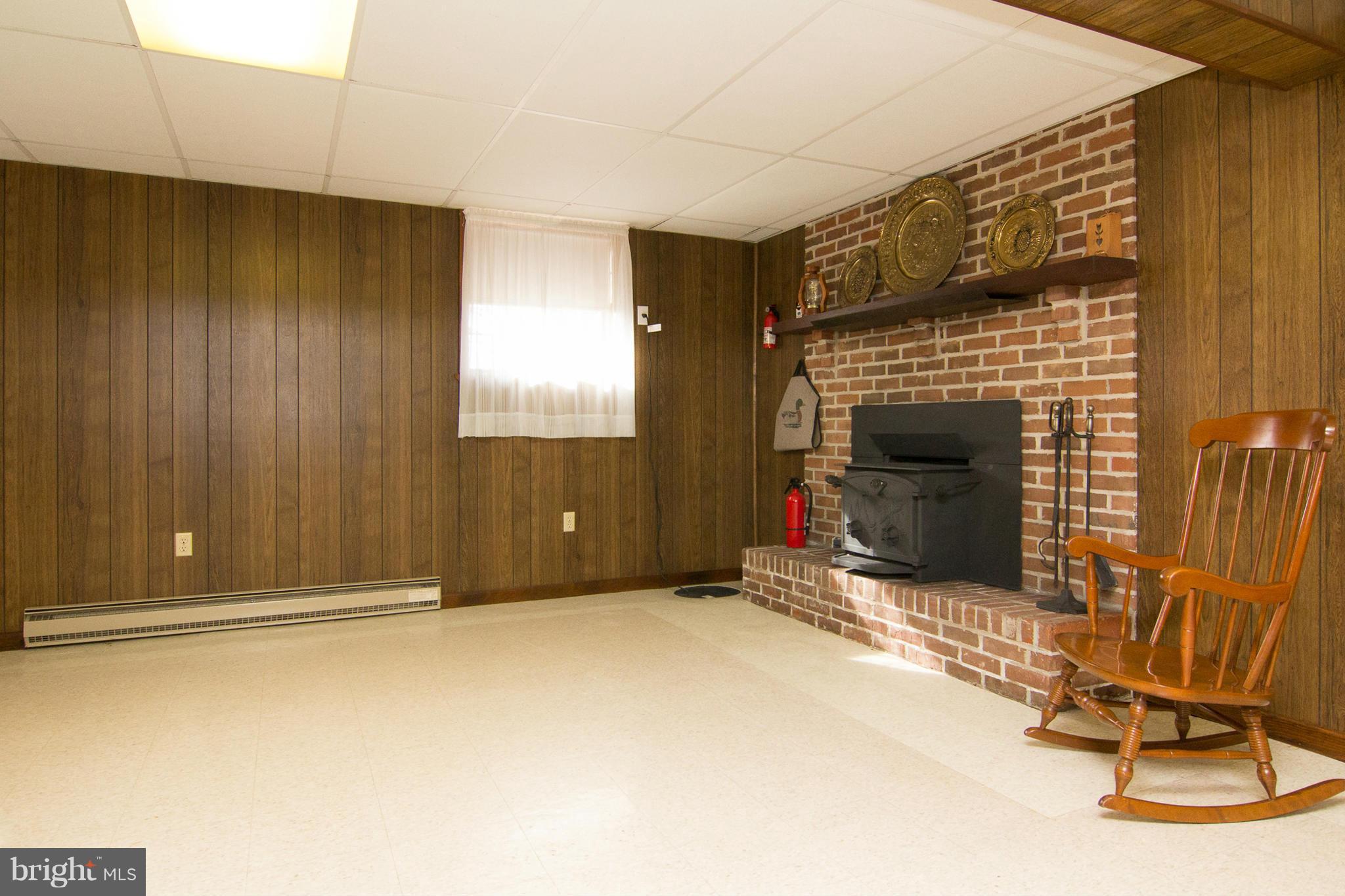 2514 Neudecker Road Westminster, MD 21157 - Photo 18 of 30 a view of an empty room with wooden floor and a fireplace