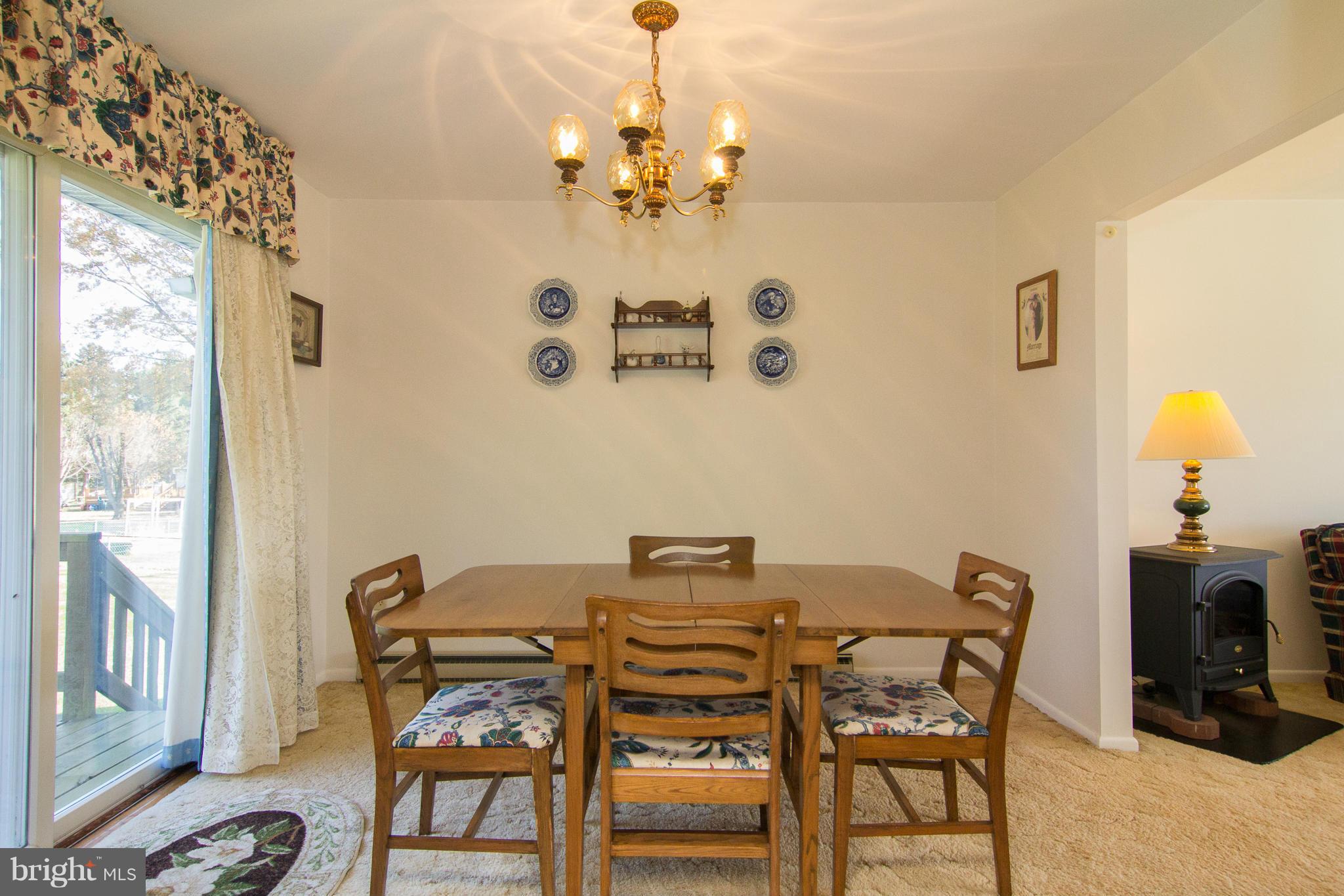 2514 Neudecker Road Westminster, MD 21157 - Photo 5 of 30 a view of a dining room with furniture and chandelier