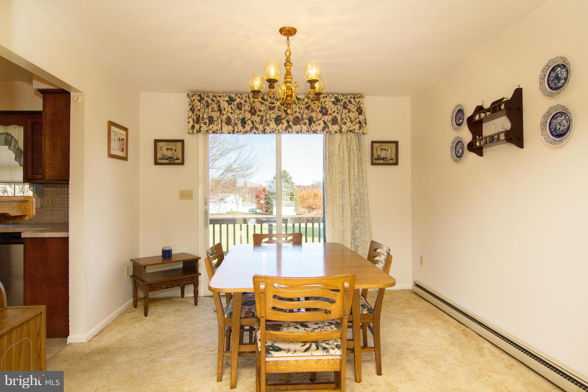 2514 Neudecker Road Westminster, MD 21157 - Photo 6 of 30 a view of a dining room with furniture window and outside view