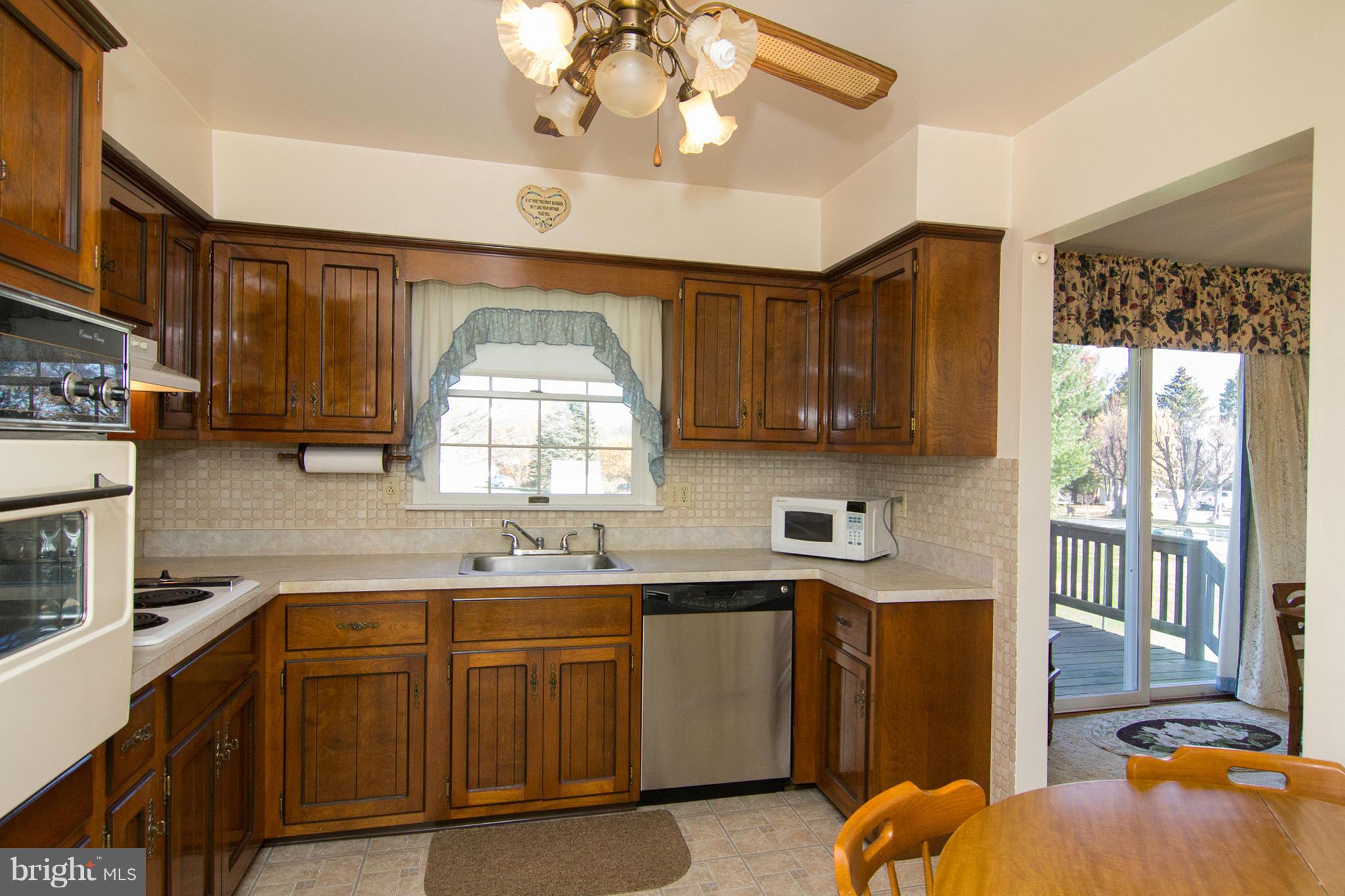 2514 Neudecker Road Westminster, MD 21157 - Photo 7 of 30 a kitchen with a sink cabinets and window