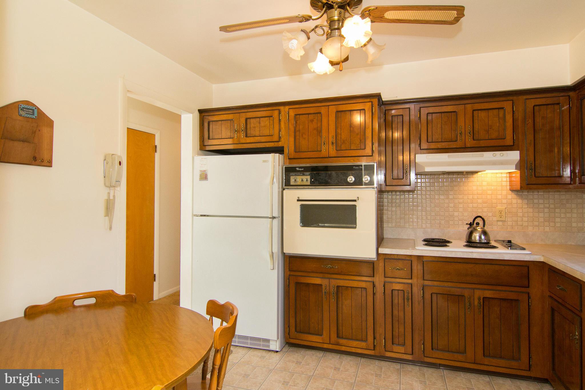2514 Neudecker Road Westminster, MD 21157 - Photo 8 of 30 a kitchen with stainless steel appliances granite countertop a sink a stove and cabinets